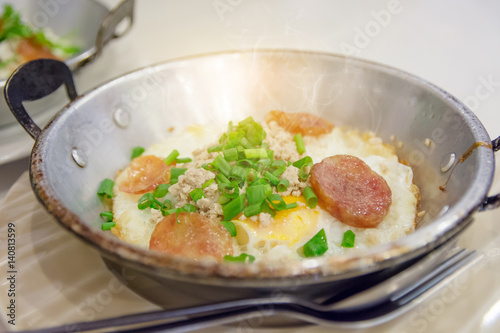 Fried egg with pork and smoke on mini pan