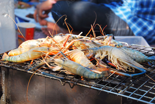 Grilling fresh shrimps.
