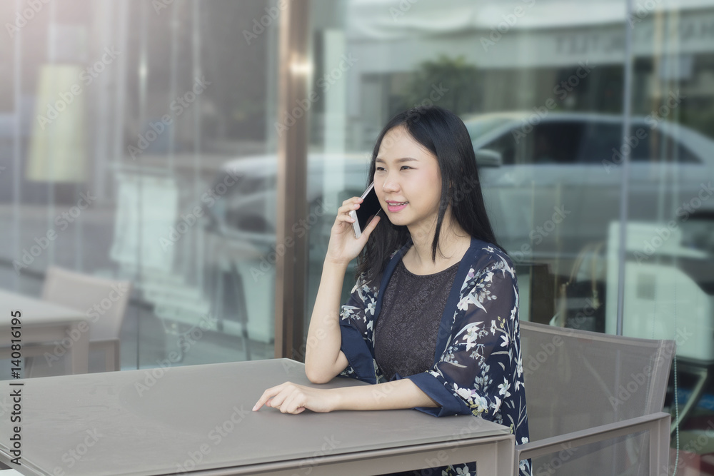 Fototapeta premium Asian woman is happiness when negotiating successful in business
