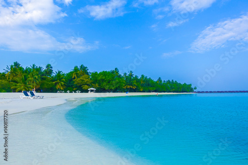 Fototapeta Naklejka Na Ścianę i Meble -  Beautiful tropical island luxury resort with white sand, turquoise sea and blue sky