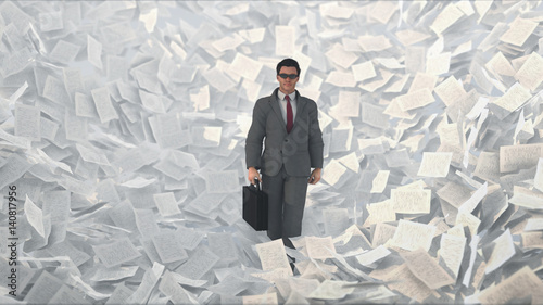 businessman in a paper storm