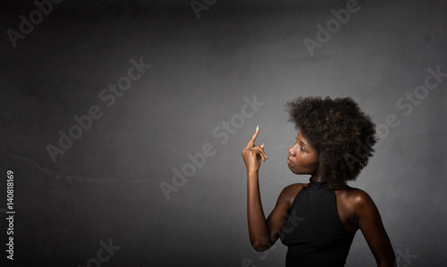 african girl showing rude gesture in profile view