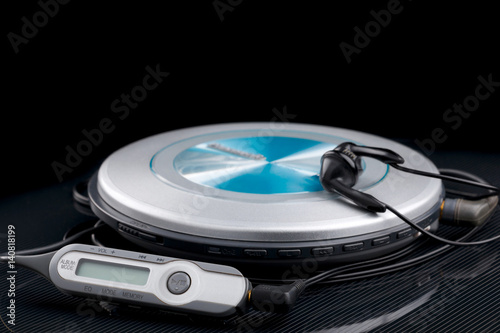 personal cd player with remote control and portable audio earphones