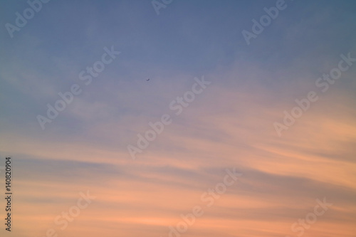 Pastel Orange and Blue Tropical Sunset Sky with the Airplane, Bangkok, Thailand © jobi_pro