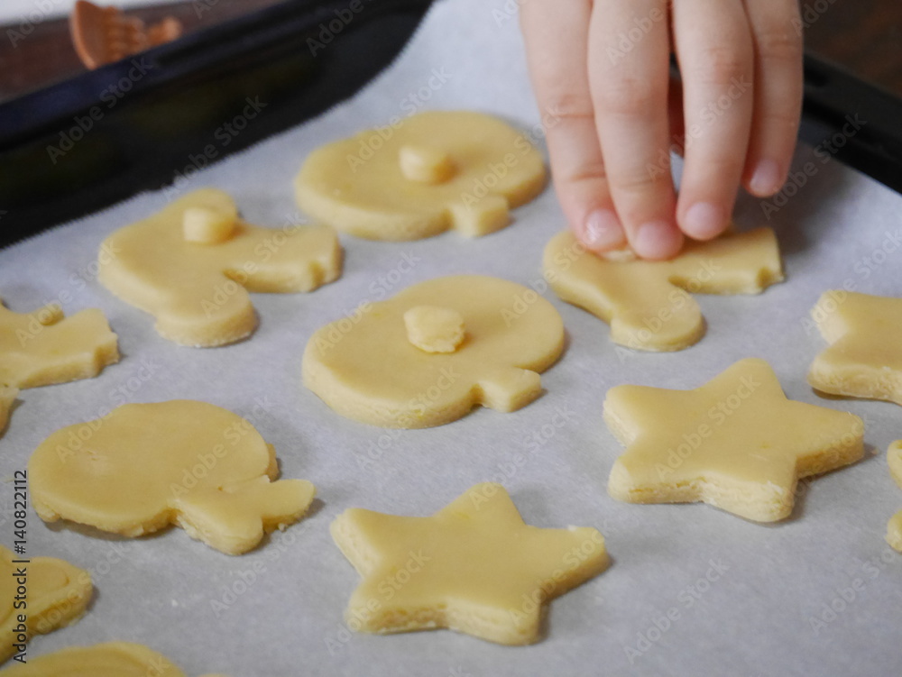 A child making cut-out cookies