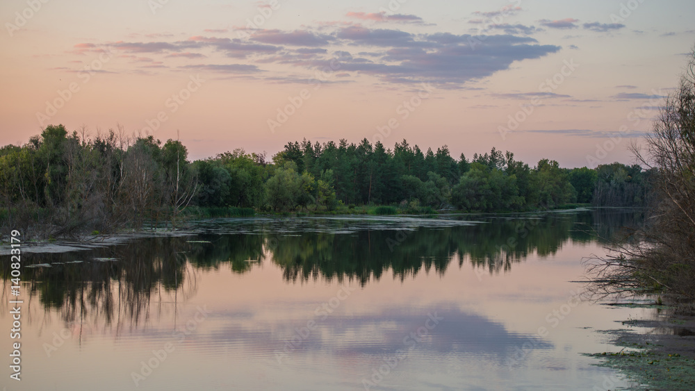 Fototapeta premium Rural scenery in the evening by the river