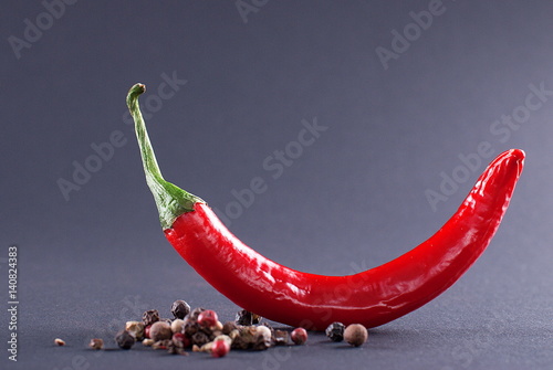 Red pepper on a dark background  side view