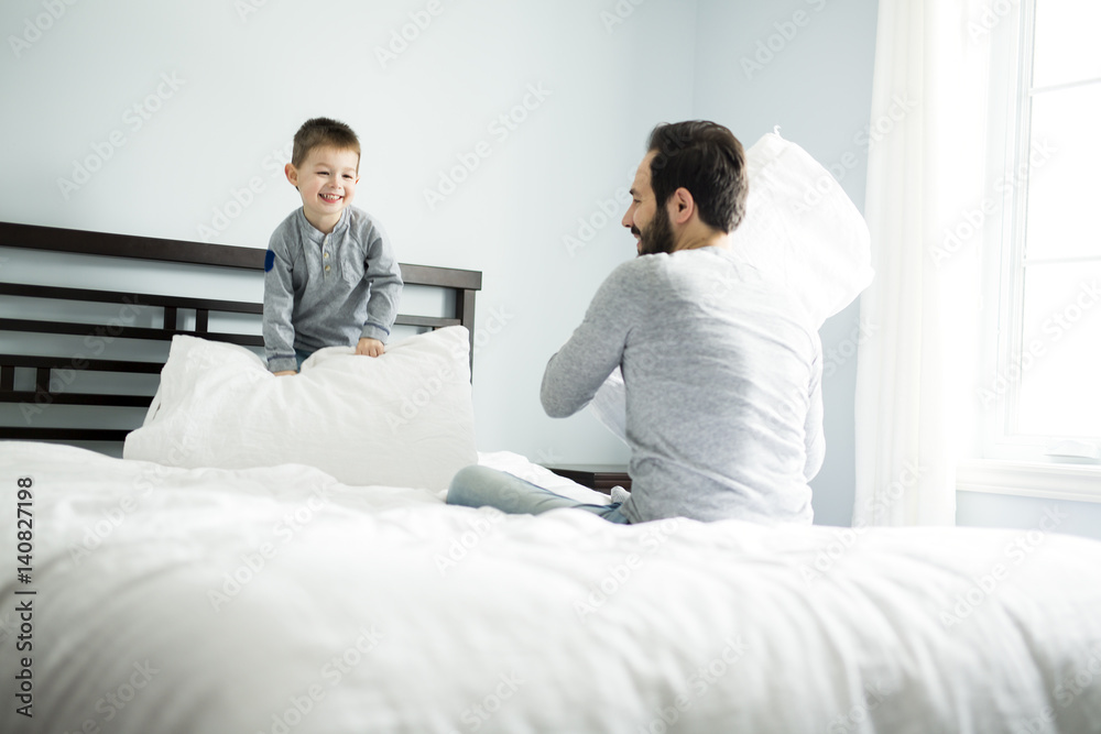Father and son in bed, happy time on bed Father and son in bed, happy time on bed