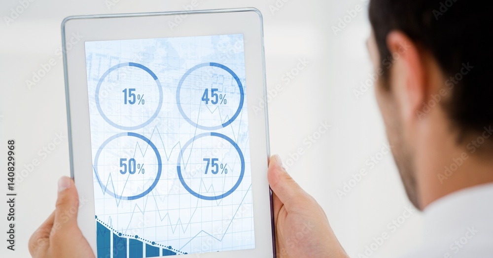 Man looking at graph chart on digital tablet Man looking at graph chart on digital tablet