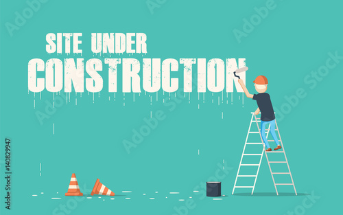 Painter painting the word site under construction on a wall.