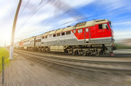 Freight train long locomotive rides speed railway