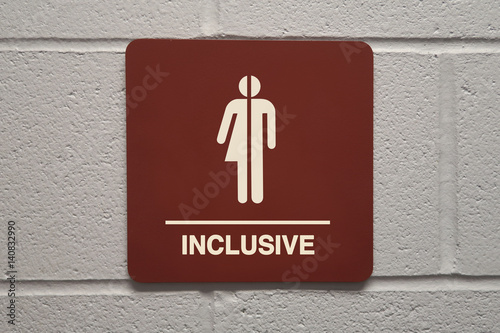 Gender neutral restroom sign that says, INCLUSIVE