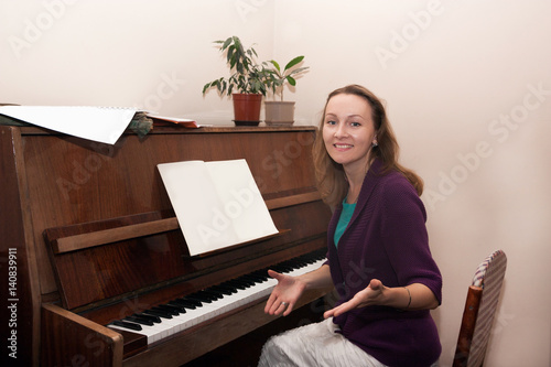 woman teacher playing the piano
