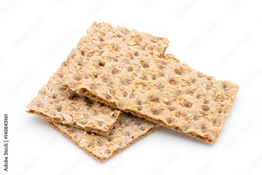 Stack of wholegrain crispy bread with sunflower, chia and sesames seeds Stack of wholegrain crispy bread with sunflower, chia and sesames seeds