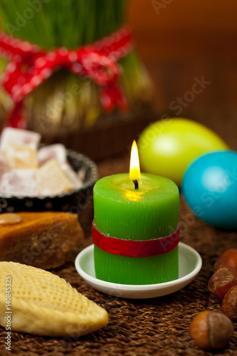 Colored eggs, wheat springs Nowruz Holiday in Azerbaijan. Selective focus.