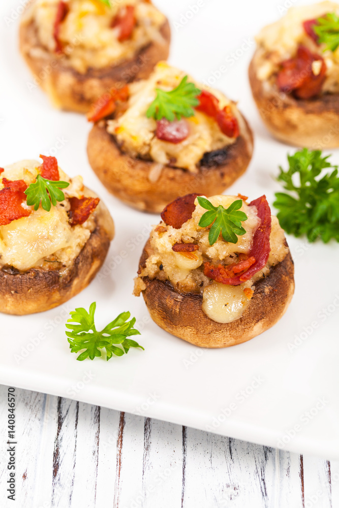 Bacon Stuffed Mushrooms with Breadcrumbs and Cheese. Selective focus. Bacon Stuffed Mushrooms with Breadcrumbs and Cheese. Selective focus.