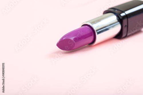 Lipstick isolated on pink background