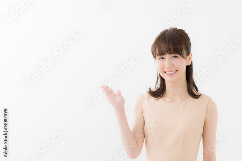 portrait of attractive asian woman showing isolated on white background