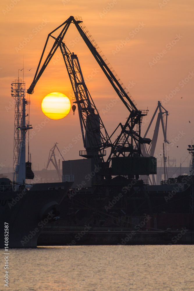 Industrial port dockyard with sunset in Portrait