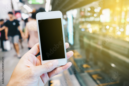 Smartphone black screen in hand at train station