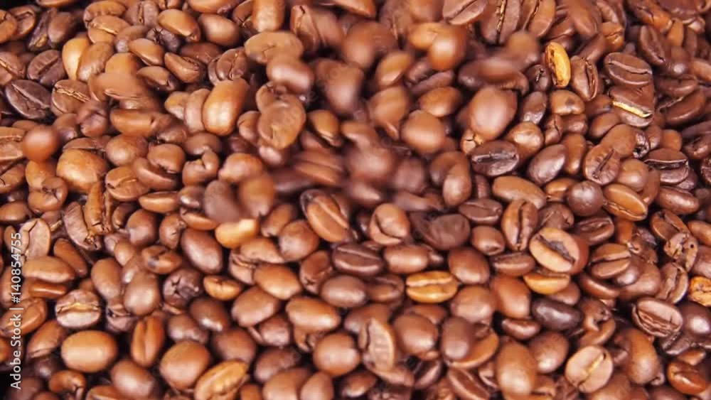Coffee beans. Close-up. Along coffee beans. Floating over fried coffee. Slow-motion Coffee beans. Close-up. Along coffee beans. Floating over fried coffee. Slow-motion