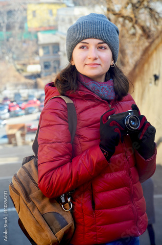 A beautiful young woman with a camera