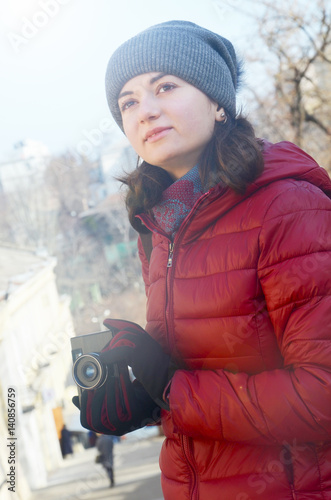 A beautiful young woman with a camera