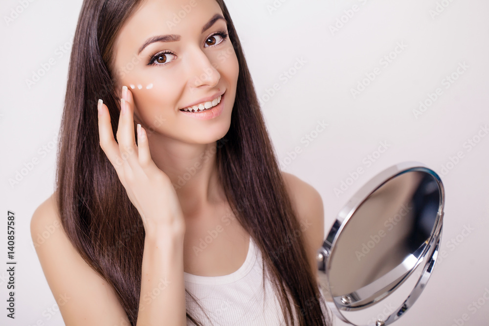 Beautiful woman face close up studio on pink. Picture of beautiful woman beautiful woman in spa salon. Clean Fresh Skin touch own face. Facial treatment . Cosmetology, beauty and spa Beautiful woman face close up studio on pink. Picture of beautiful woman beautiful woman in spa salon. Clean Fresh Skin touch own face. Facial treatment . Cosmetology, beauty and spa
