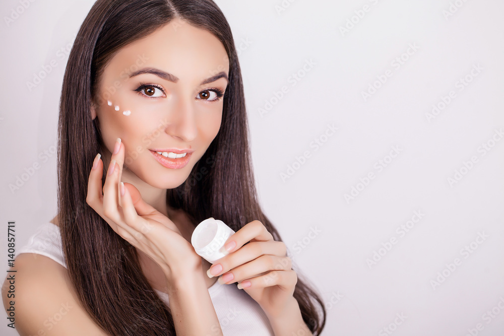 Beautiful Young Woman with Clean Fresh Skin touch her face . Facial treatment . Cosmetology , beauty and spa . Beautiful Young Woman with Clean Fresh Skin touch her face . Facial treatment . Cosmetology , beauty and spa .