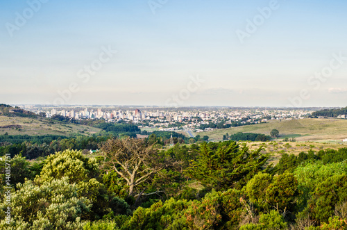 Panoramic view on the city of Tandil in Argentina from the hill. Landscape and cityscape. © Aleksandr Vorobev