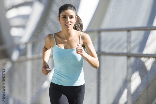 young beautiful athletic sport woman running and jogging crossing modern metal city bridge © Wordley Calvo Stock