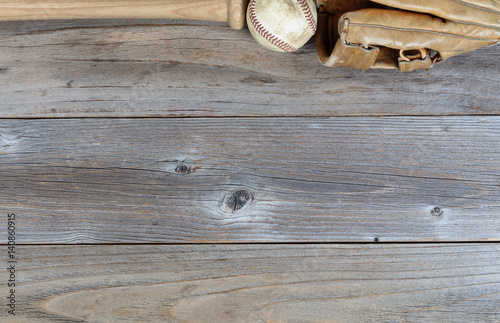 Photography Top border of used baseball equipment on rustic wooden boards