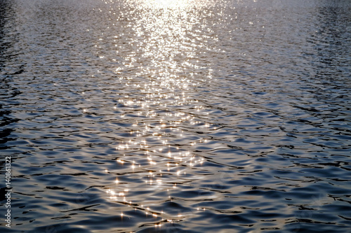 Sparkle of sunlight hit the surface of the water.