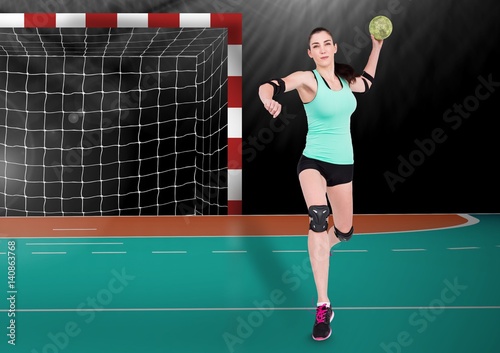 Athlete playing handball against stadium in background © vectorfusionart