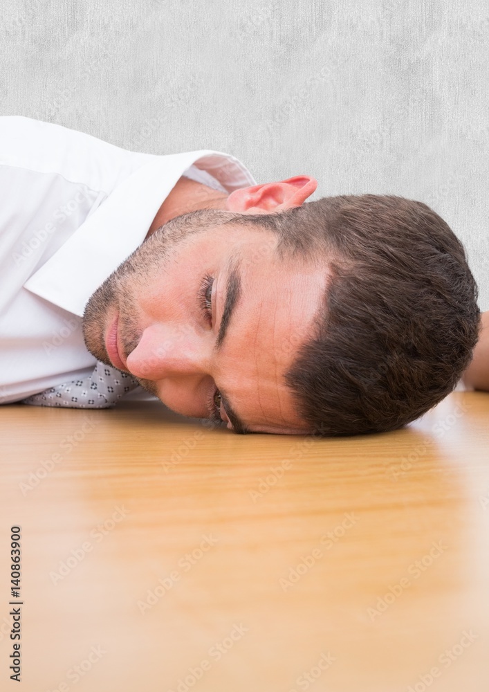 Man laying his head in the desk Man laying his head in the desk