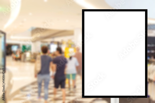 Billboard for store front, Advertising poster sign and blurred people in the shopping mall as background, for montage display, Mock up for display of product.