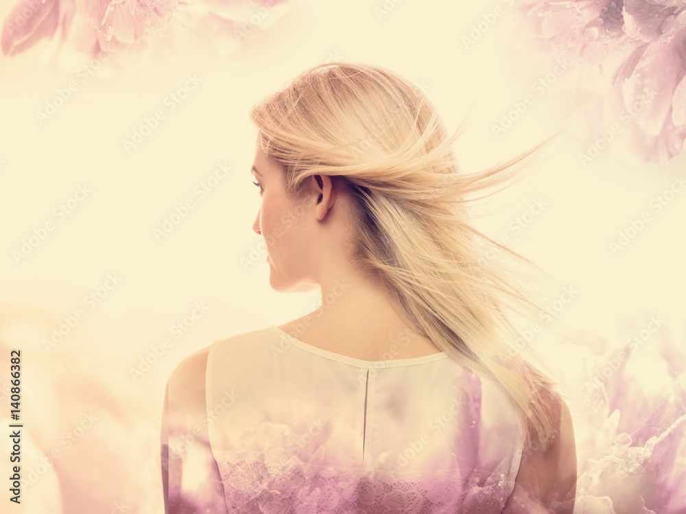 Young woman on a pink floral background