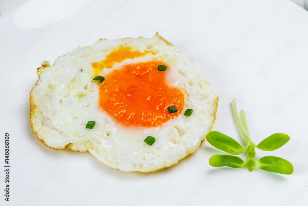 fried egg heart-shaped for breakfast on plate fried egg heart-shaped for breakfast on plate