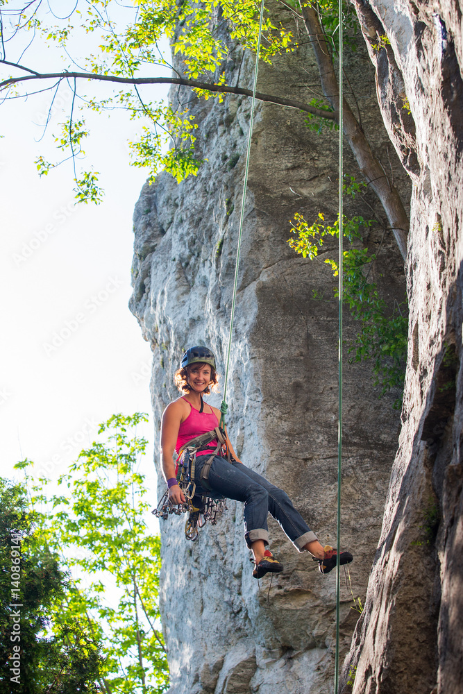 Woman rock climbing on Ontario's Niagara Escarpment in Canada