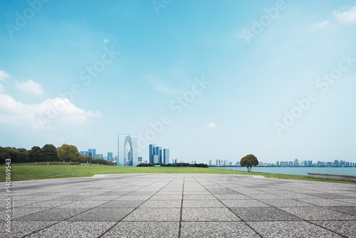 empty brick floor and cityscape of modern city photo