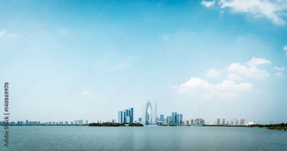 tranquil lake and cityscape of modern city