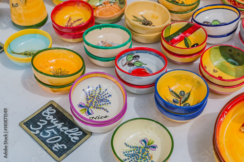 Ceramic souvenir pottery dishes at the Cours Saleya famous market in Nice France © SvetlanaSF