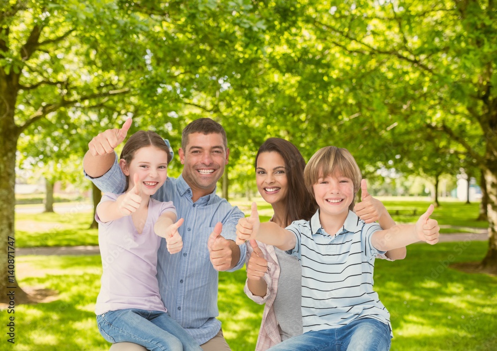 Fototapeta premium Family showing thumbs up in park