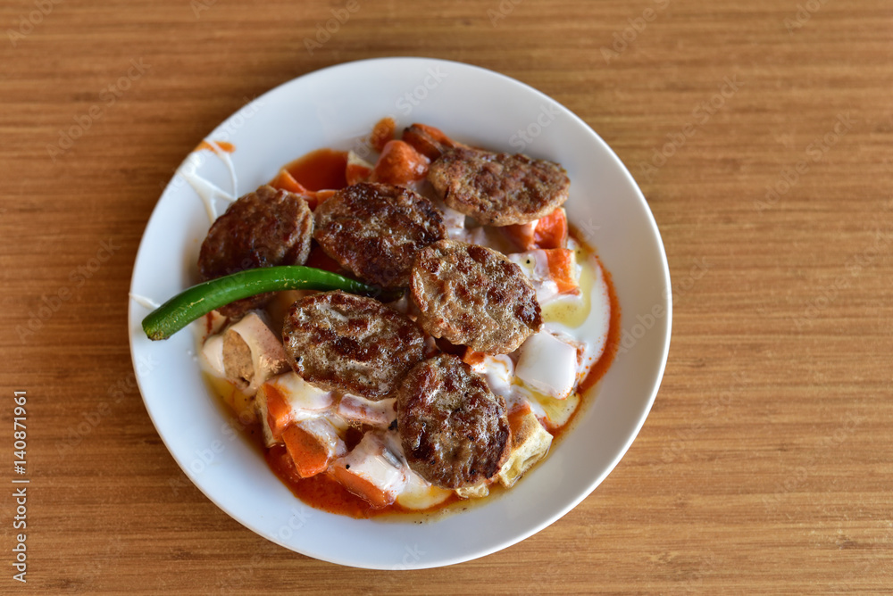 Turkish cuisine style grilled meatball on a famous restaurant in Turkey Turkish cuisine style grilled meatball on a famous restaurant in Turkey