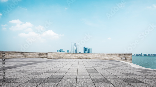 empty brick floor and cityscape of modern city photo