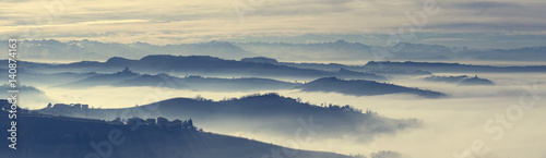 Panoramic view of Langhe hills in a foggy morning photo