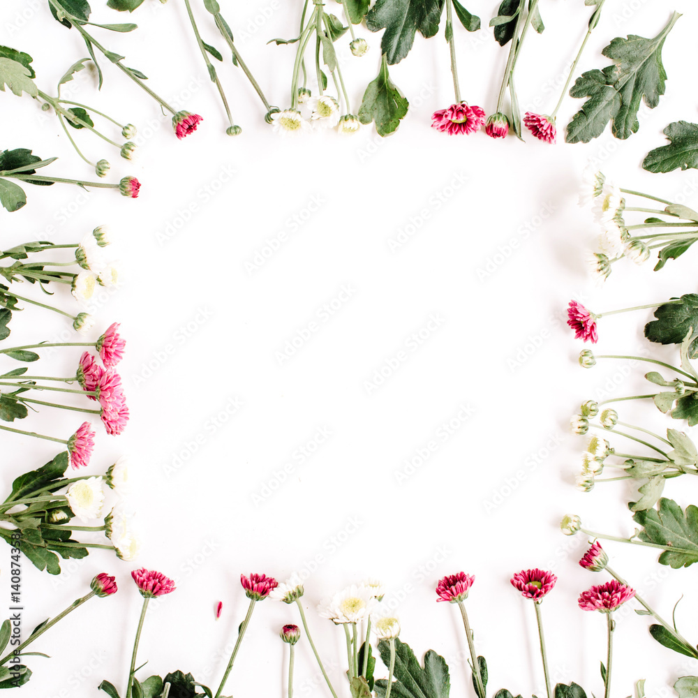 Wreath frame of red and white wildflowers, green leaves, branches on white background. Flat lay, top view. Valentine's background Wreath frame of red and white wildflowers, green leaves, branches on white background. Flat lay, top view. Valentine's background