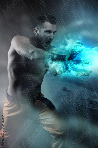 Quadro su tela Young man doing an energy blast