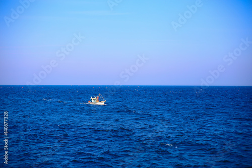 A boat in the middle of the sea © 석기 배