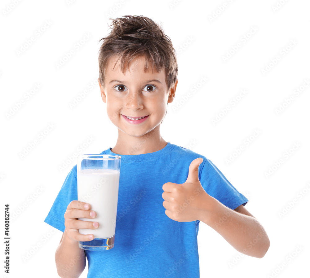 Cute boy in blue shirt holding glass of milk on white background Cute boy in blue shirt holding glass of milk on white background